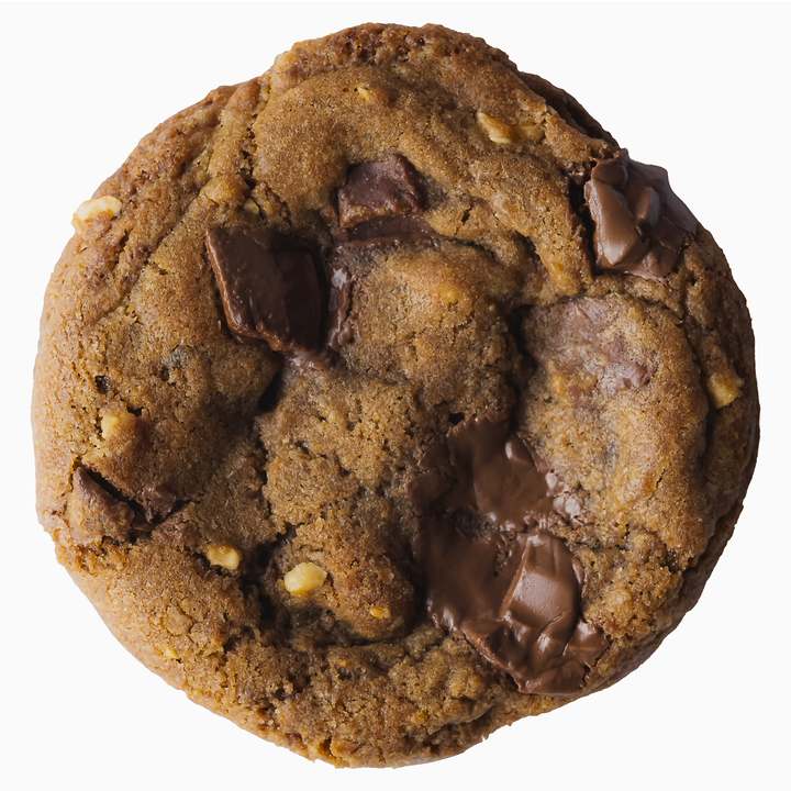 A real Dates, Hazelnut and Milk Chocolate cookie with melted chocolate chunks